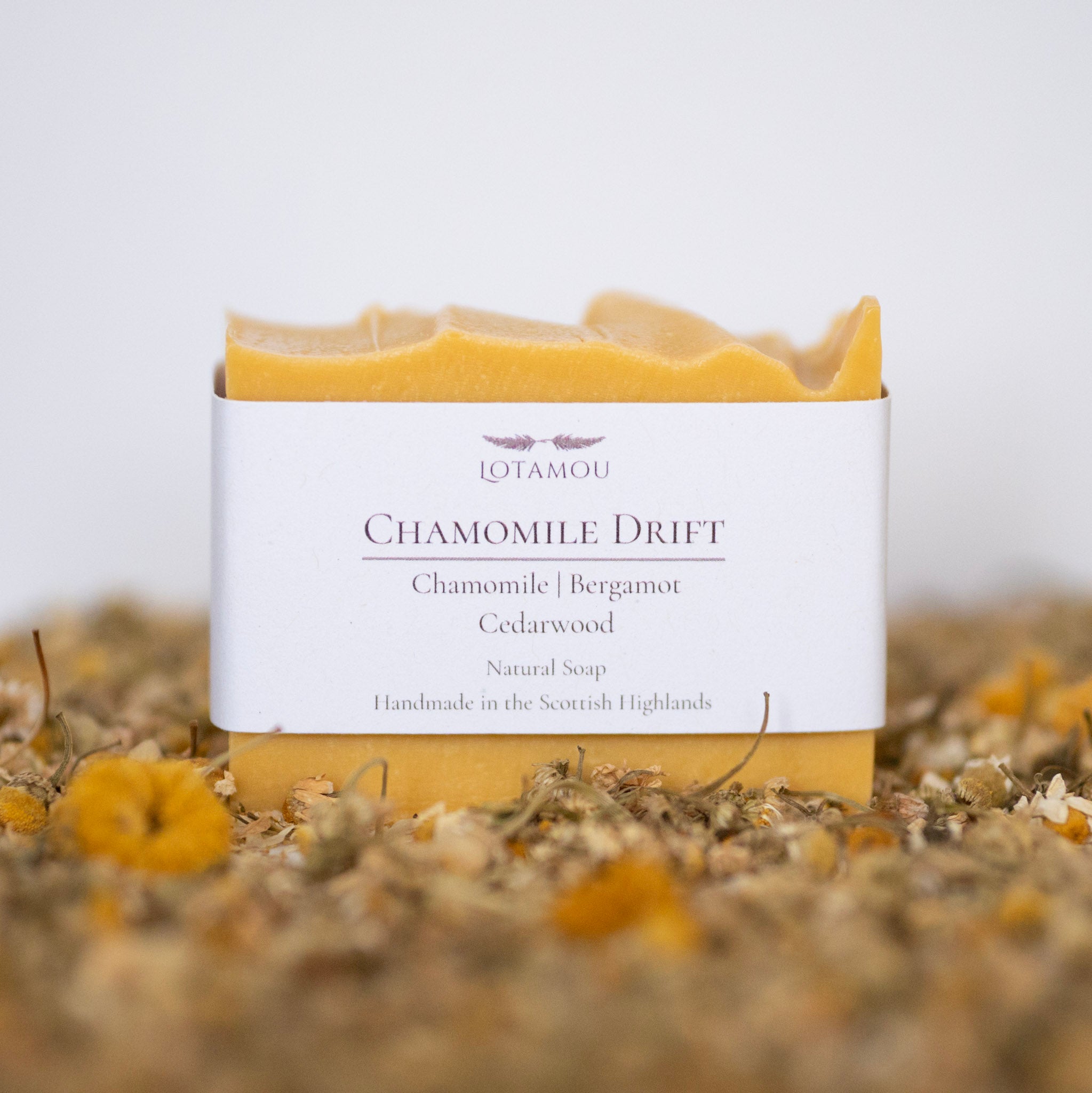 Soap bar with 'LOTAMOU' branding on a white background